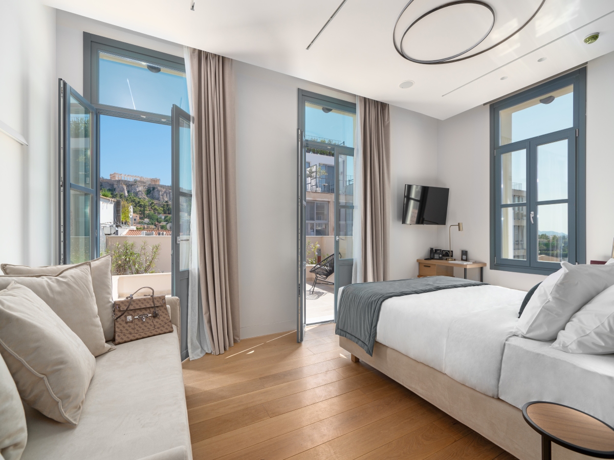 A luxury room at the Hellenic Vibes Hotel overlooking the Acropolis from its veranda